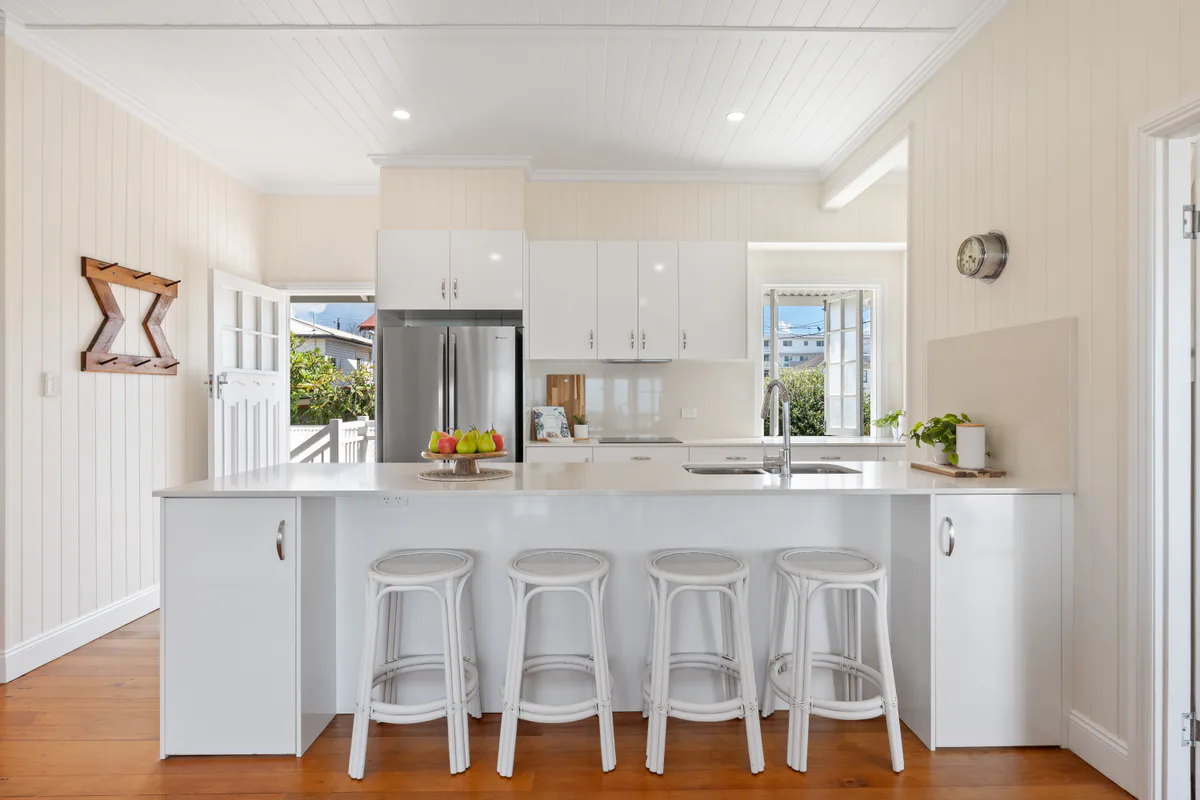 Bright white kitchen with a central island