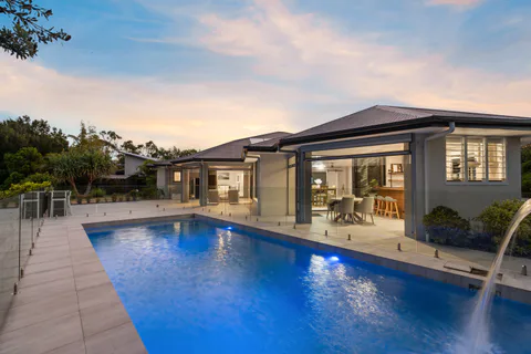 Contemporary Brisbane home with a swimming pool photographed at twilight